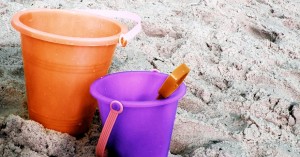 Summer Company Bucket List image of sand buckets on the beach