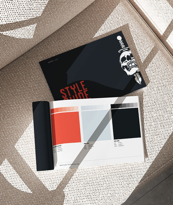 Key Components of a Brand Guide 1 Two books laying on a couch / Brand guides are the foundation of your identity.