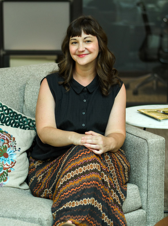 About 3 Photo of Melissa sitting in a chair at Versa Coworking